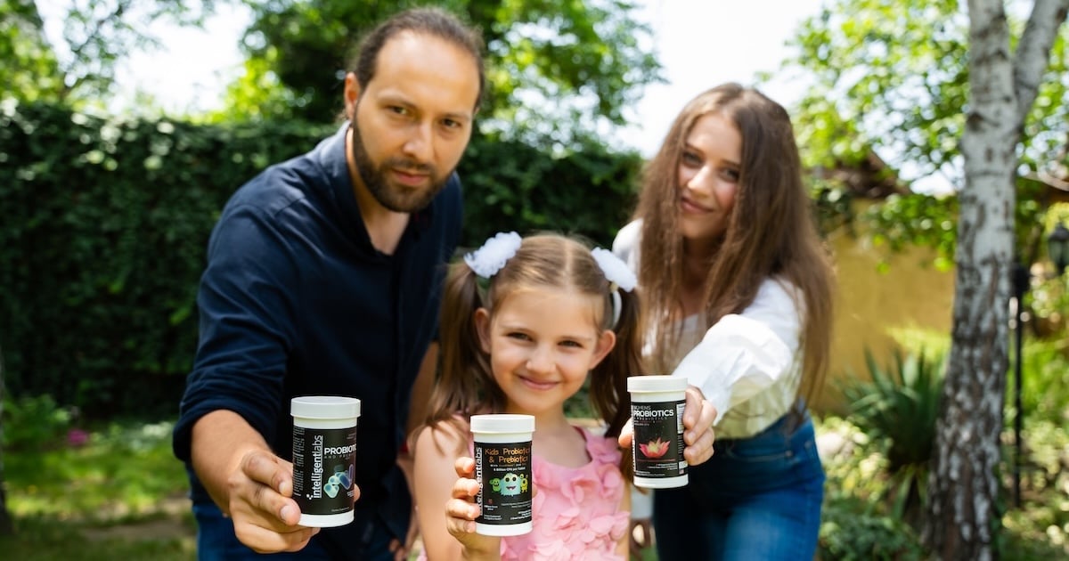 family holding bottles of intelligent labs probiotics